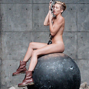 Miley Cyrus Strips, Swings Around Naked in 'Wrecking Ball'