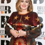 Adele with two of her four Brit Awards