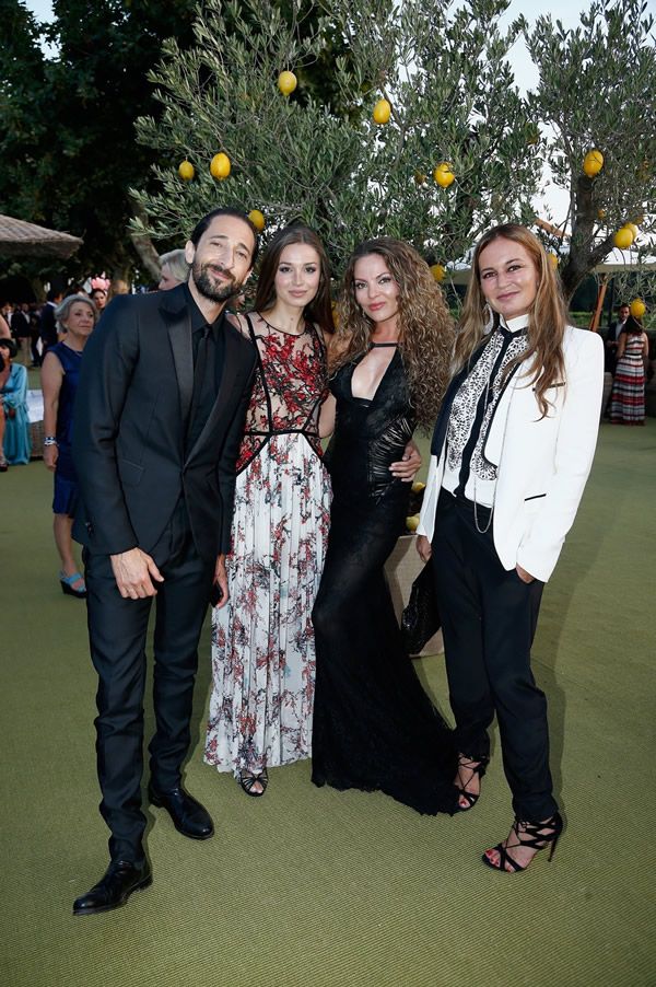 Adrien Brody, far left, Lara Lieto, second from left, and Eva Cavalli, far right