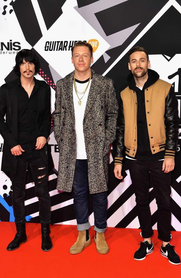 American hip-hop duo Macklemore and Ryan Lewis pose with Eric Nally