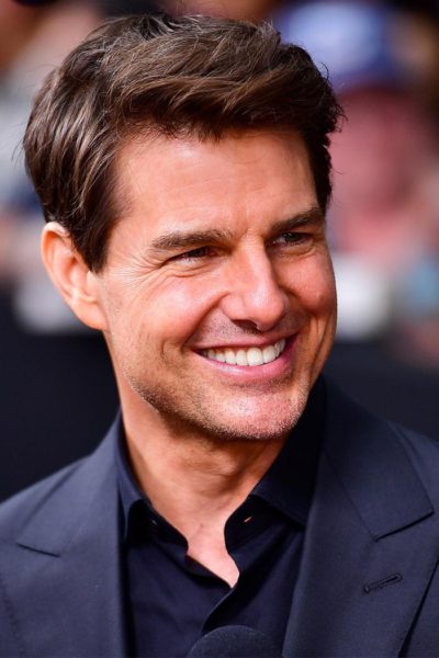 The Real Story Behind Tom Cruise's Signature Smile (and Misaligned Teeth)