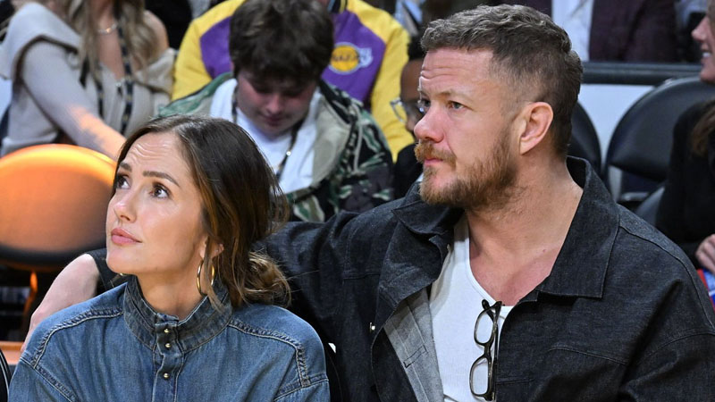 Minka Kelly and Dan Reynolds attend a basketball game